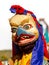 Monk in Garuda mask bird-like creature in Hindu, Buddhist and Jain mythology performs religious mystery dance of Tibetan Buddhis