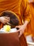 Monk is offered food by buddhist