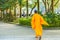 Monk in orange running