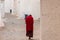 Monk in red robes in a monastery in Punakha, Bhutan