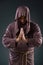 The monk in religious concept on gray background