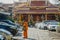 A monk stopped near a Buddhist temple