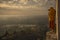 Monk taking photos in the sunrise valley of bagan