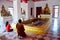 Monk and thai woman praying Buddha\'s footprint 4 footprints