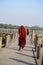 Monk walk along U Bein Bridge