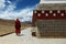 Monk walking around tibetan stupa