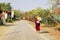 A monk is walking on the road in Bagan, Myanmar