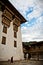 A monk walks the courtyard of the Punakha Fortress Monastery, Paro, Bhutan