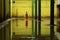 a monk walks through a puddle of water in an abandoned building