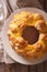 Monkey bread with cheese close-up on the table. vertical top vie