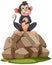 A monkey perched atop a pile of stones