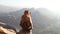 Monkey sitting on a stone wall