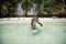 Monkey waiting for food in Monkey Beach, Phi Phi Islands, Thailand