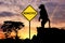 Monkeypox. Silhouette of a monkey next to a road warning sign with the word Monkeypox