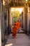 The monks in the ancient stone faces of Bayon temple, Angkor