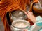 The monks of the Buddhist Sangha give alms to a Buddhist monk, which came out of the Buddhist offerings in the morning. The