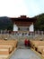 Monks entering Lhakhang Karpo White temple in Haa valley located in Paro, Bhutan