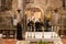 The monks after finishing prayer leave the main altar of the Church of the Annunciation in the Nazareth city in northern Israel