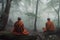 monks meditating in misty forest, with tree tops visible