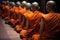 monks meditating in row, with their backs turned to each other