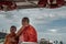 The Monks and novices stood on the Chao Phraya Express Boat to travel by water to the temple