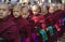 Monks in a row waiting for lunch: Mahagandayon Mon