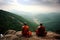 monks, sitting in meditation on mountaintop, surrounded by the serene and peaceful majesty of nature