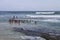 Monks Swimming in Indian Ocean