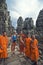 Monks and turist girl at Angkor Wat
