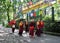 Monks Walking Amid Prayer Flags Flutter