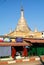 Monks walking in front of the stupa at the village of Kalaw on M