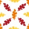 Mono print style leaves seamless vector pattern background. Textured cut out yellow, red, orange foliage on white