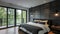 A monochromatic bedroom features a striking accent wall made of dark gray fiber cement panels. The panels provide a