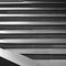 A monochromatic image of light and shadow on a staircase, creating an abstract play of depth and contrast1, Generative AI