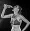 Monochrome of an Athletic Woman Drinking Water