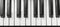 Monochrome close up image of a black and white piano keyboard, showcasing detailed keys