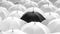 Monochrome Contrast: Black Umbrella Amidst a Sea of White