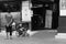 Monochrome, A disabled person in a wheelchair having a conversation near a shop in Malioboro