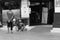 Monochrome, A disabled person in a wheelchair having a conversation near a shop in Malioboro