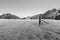 Monochrome flat farmland between Soutern Alps mountains