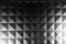 Monochrome image, geometric abstract square pattern on a piece of plastic