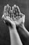 Monochrome image of a praying hands.