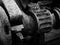 Monochrome image of rusted cogs and gears on an old abandoned broken industrial machinery