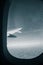 A monochrome look outside the window of a plane.