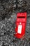 Monochrome photo with Queen Elizabeth style red English post box.