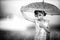 monochrome portrait of happy little girl with umbrella