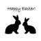 Monochrome silhouette of two Easter bunny rabbits.