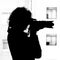 Monochrome silhouette of a woman with a SLR camera