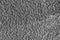 Monochrome texture of shiny grained metal. Abstract background.