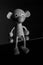 Monochrome vertical shot of a wooden monkey toy